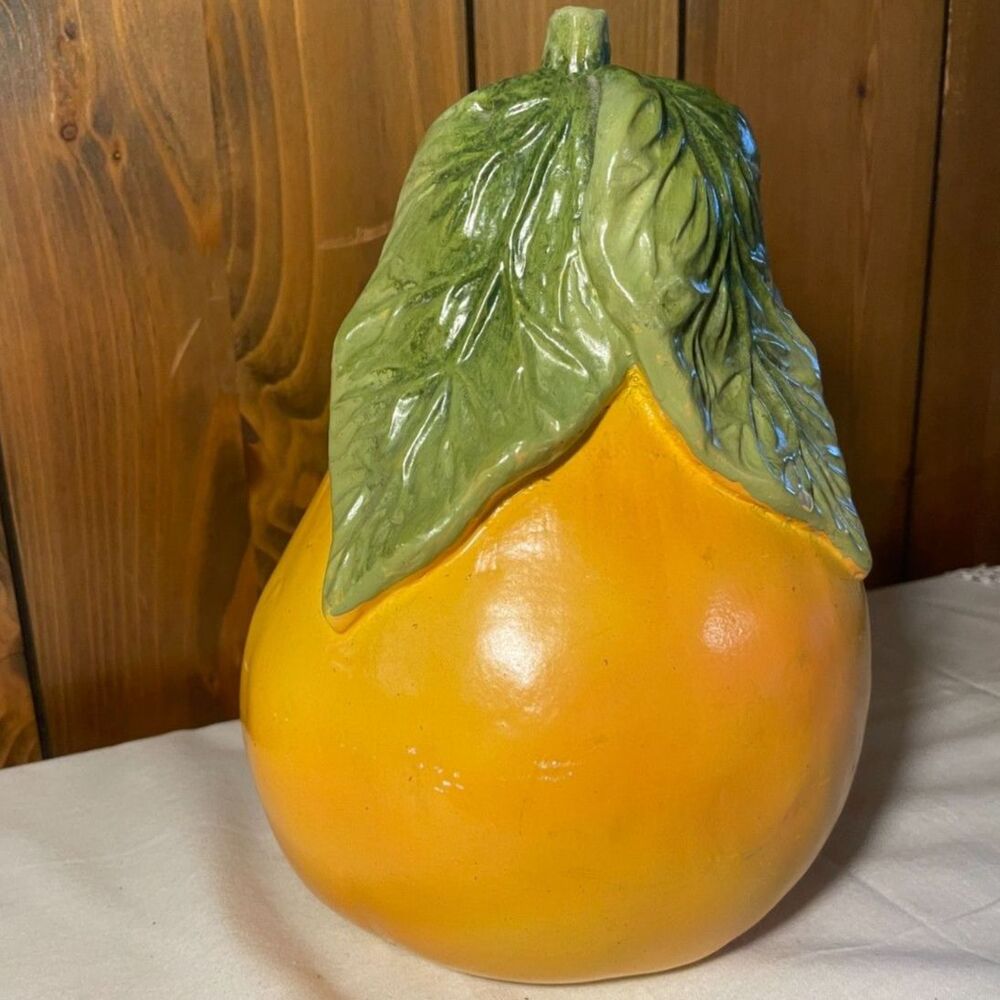 Large, glossy ceramic decorative pear